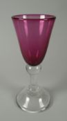 ANTHONY STERN ART GLASS GOBLET with amethyst coloured body and clear glass knopped stem and base,