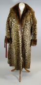A VINTAGE OCELOT LADIES COAT of three quarter size and with deep-turned brown fur collar and