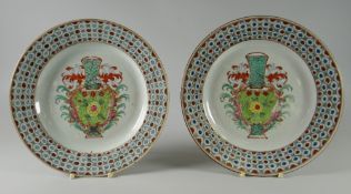 A PAIR OF NINETEENTH CENTURY CHINESE-EXPORT PORCELAIN ENAMELLED PLATES, the interiors with floral