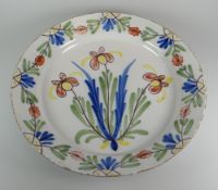 A BRISTOL DELFT PLATE probably Redcliff Back, polychrome decorated with centred stylized flowers and