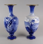 PAIR OF ROYAL DOULTON FLOW-BLUE VASES circular based, of ovoid form with flared elevated necks,