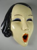 A RARE CZECHOSLOVAKIA POTTERY 'SCREAM' MASK wearing blue eye-liner and with blue-black hair,