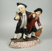 STAFFORDSHIRE MODEL 'TOWN CRIER & DRUNK' on foliate decorated base, 21cms high