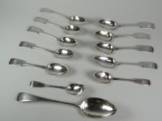 A PARCEL OF GEORGIAN SILVER SPOONS with monogrammed terminals, 8.3ozs