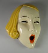 A CZECHOSLOVAKIA POTTERY 'SCREAM' MASK with blonde hair, impressed Czech mark and number to base,