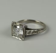 AN 18CT WHITE GOLD DIAMOND SOLITAIRE RING visual estimate 1.3ct and with tiny diamond surround and