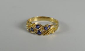 A SMALL 18CT YELLOW GOLD ANTIQUE RING set with six sapphires and diamonds, in later box