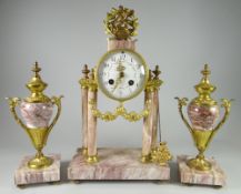 A PINK MARBLE CLOCK GARNITURE SET of Classical architectural form with the drum raised over a