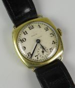 A VINTAGE GENT'S ROLCO YELLOW METAL WRISTWATCH having subsidiary dial and Arabic numerals and on