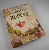 A 1936 FIRST EDITION OF 'THE NEW ADVENTURES OF RUPERT' with dust-jacket, published by Daily