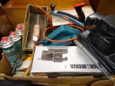 Box containing a Black & Decker half sheet sander, Black & Decker DN710 electric planer, Surform