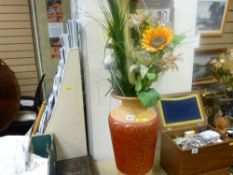 Tall pottery vase with dried flower contents