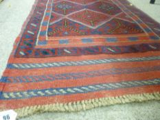 Meshwani carpet runner on a blue and red ground with central repeating diamond pattern and double