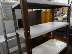 Seven tread metal stepladder and garage metal shelving unit