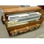 Brother knitting machine in cabinet with large quantity of wool reels and other associated items