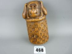 Japanese carved wooden lidded container of a monkey in a wooden basket