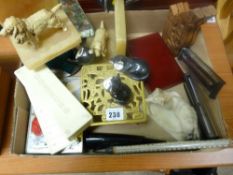 Box of collectables including mineral and resin dog bookends, kettle stand, dominoes and similar