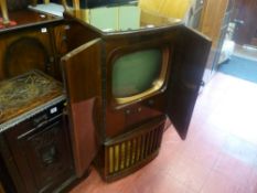 Vintage Alba television housed in a walnut cabinet
