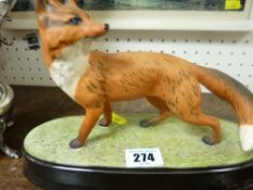 Beswick fox on a ceramic plinth
