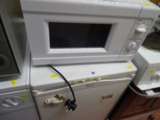 Whirlpool undercounter freezer and a white Argos microwave oven E/T
