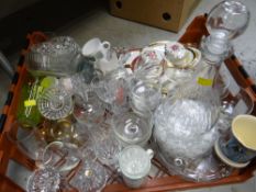 A crate of china & glassware, drinking glasses & a decanter
