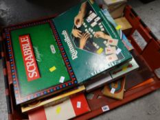 A selection of children's games including Cluedo, Monopoly, Scrabble etc together with a crib