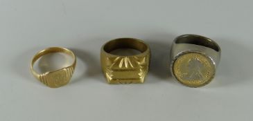 A 9ct gold gents signet ring, 4.1grms, a silver coin set signet ring together with a brass ring