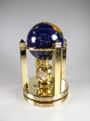 A boxed Meridian gemstone globe, clock barometer