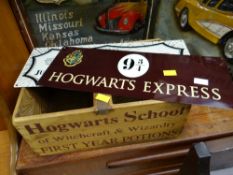 A wooden Hogwarts School box together with two small enamel signs