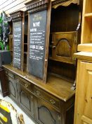 A dark oak Priory-style dresser