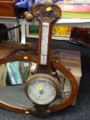 A mahogany aneroid barometer