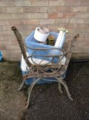 Pair of cast metal bench ends, pots etc (outside)