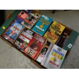 A box of paperback novels, mainly war related