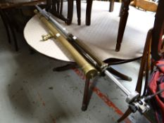 A brass telescope & camera tripod stand
