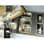 Two volumes of postcards of military interest including Hitler, Mussolini, Churchill together with a