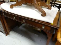 An Edwardian mahogany gallery top two-drawer desk