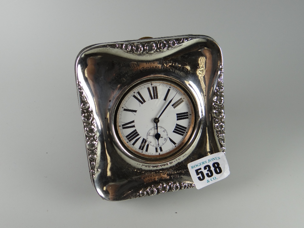 A pocket watch in a silver frame inscribed St John The Baptist Sunday School, Bristol, dated 1911