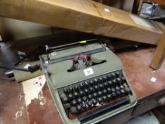 Vintage Olympia typewriter, vintage camp bed & projector screen