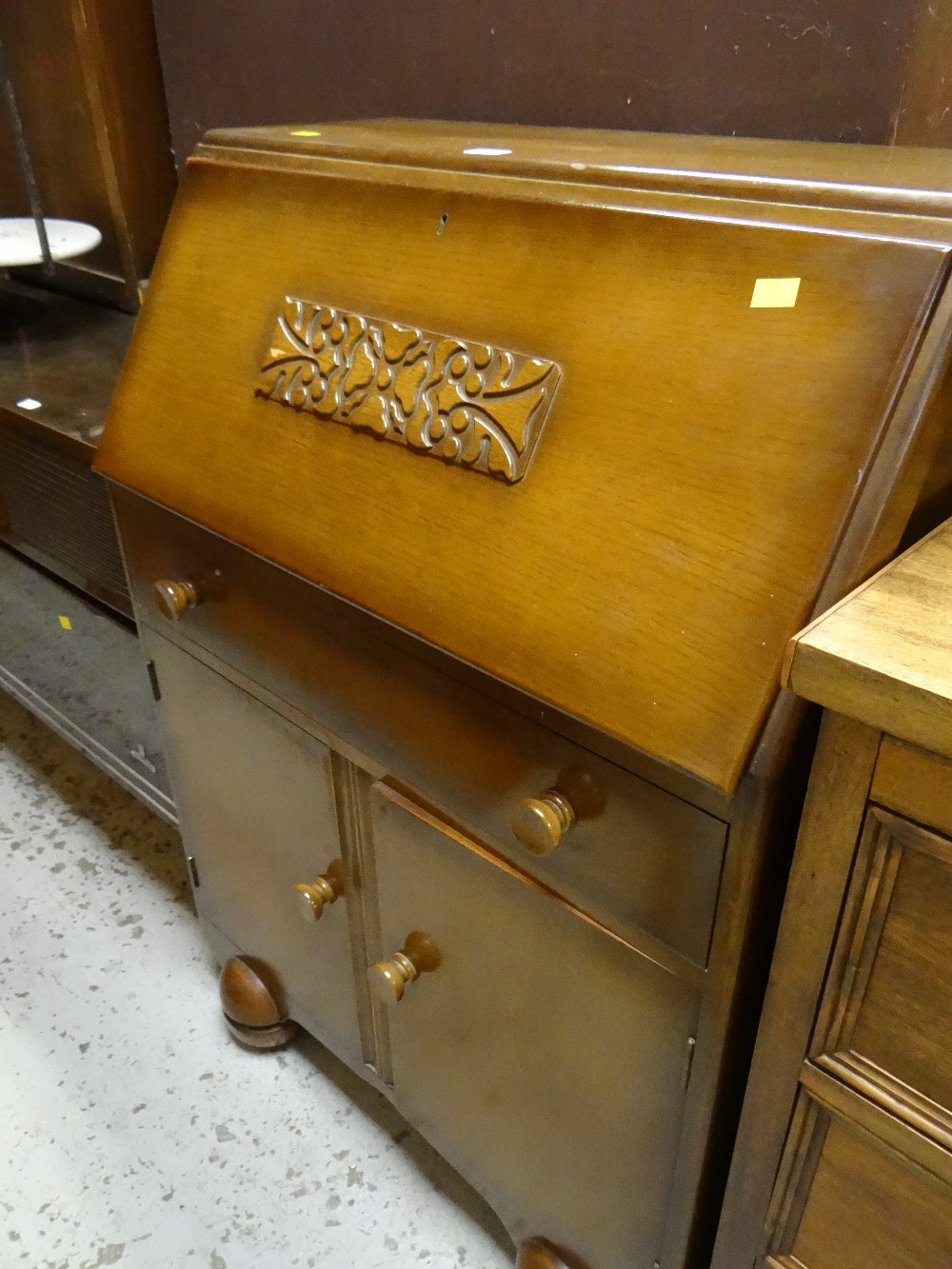 A vintage drop down bureau together with a Grundig radiogram