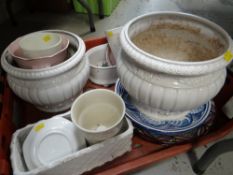 A crate of ornamental plates together with garden planters, flower pots etc