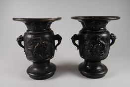 A good pair of small Chinese-style bronze vases decorated with birds