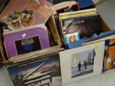 Two boxes of LPs including ABBA, Paul Simon, Pink Floyd ('Wish You Were Here'), The Beatles, Neil