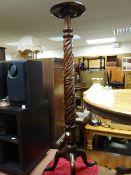 A nice mahogany acanthus leaf decorated torchere stand