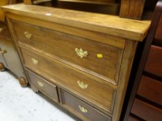 A stained chest of drawers, two long above two short