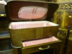 Polished wood sewing box with upholstered interior single front drawer on tapered supports