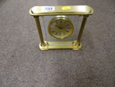 Heavy brass effect and glass mantel clock by 'The Clock Company' and a small parcel of sticks and