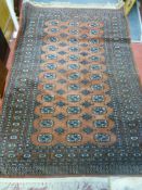 Red and blue symmetrical pattern tassel end rug