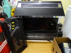 Electra Sovereign black and silver electric heater and a small black mesh fireguard E/T