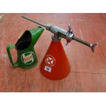 Small metal red conical pressure sprayer and a green metal pint measure with Castrol Motor Oil