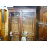 Mahogany two door glazed adjustable shelf bookcase/cupboard